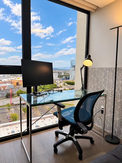 Workspace with monitor and city views