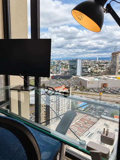 Workspace with monitor and city views