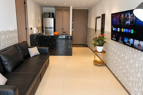Living room and open kitchen at the Torres Boudica apartment