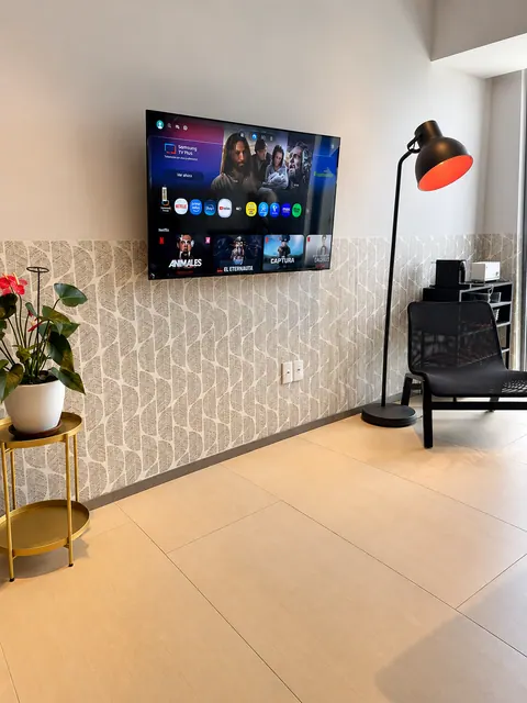 Living room with smart TV and warm lighting