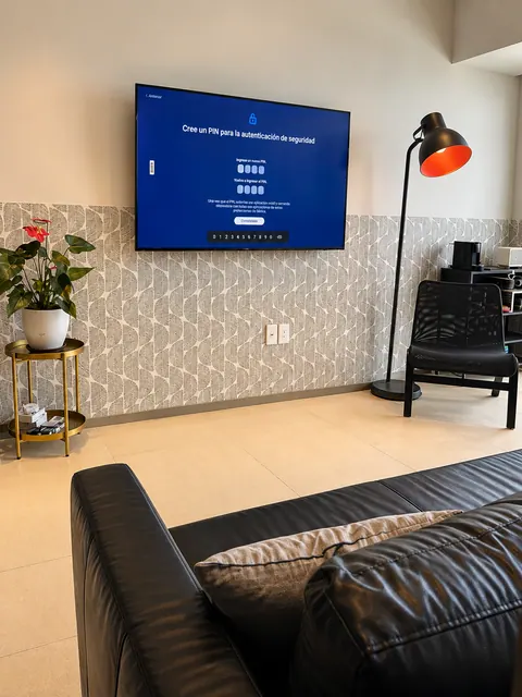 Living room with smart TV and warm lighting